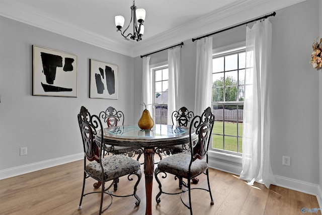 17092 Obsidian Cir, Athens, AL 35613 - dining room with a chandelier, light wood finished floors, baseboards, and ornamental molding