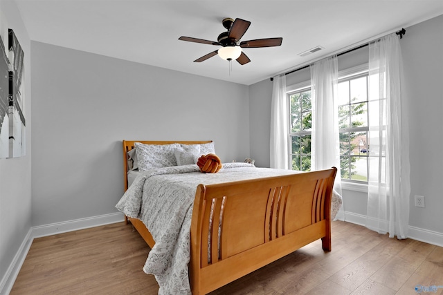 17092 Obsidian Cir, Athens, AL 35613 - bedroom featuring baseboards, light wood-style flooring, and ceiling fan