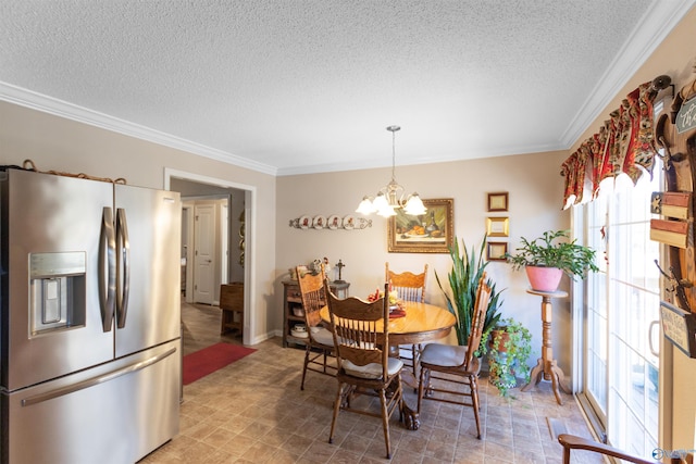 dining room featuring ornamental molding, a textured ceiling, and an inviting chandelier