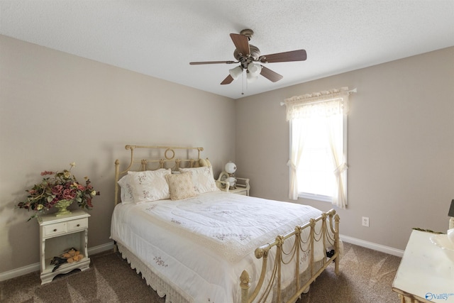 carpeted bedroom with a textured ceiling, a ceiling fan, and baseboards