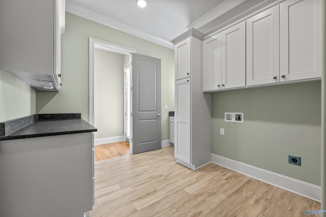 78 Mcmullen Ln SE, Gurley, AL 35748 - laundry room featuring hookup for an electric dryer, cabinet space, light wood-style flooring, baseboards, and washer hookup