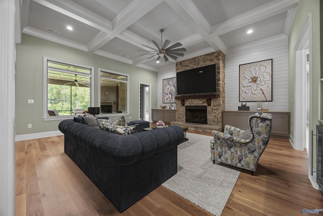 78 Mcmullen Ln SE, Gurley, AL 35748 - living room with a fireplace, ceiling fan, wood finished floors, beam ceiling, and coffered ceiling