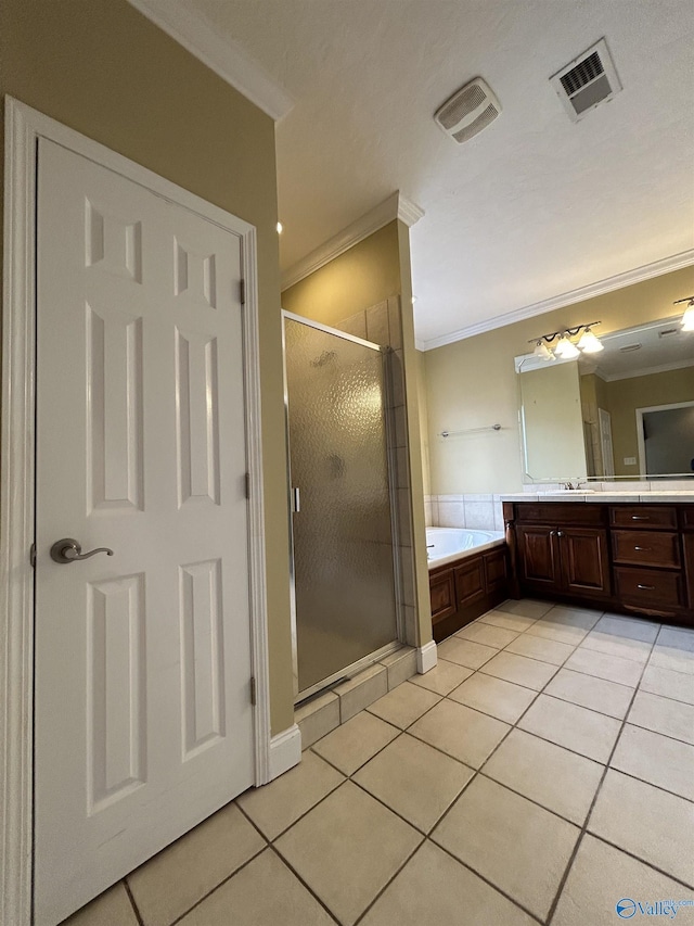 bathroom with vanity, ornamental molding, tile patterned floors, and plus walk in shower