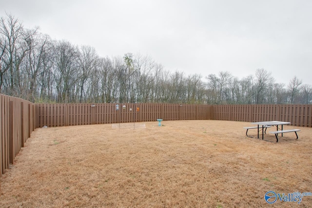 view of yard with a fenced backyard