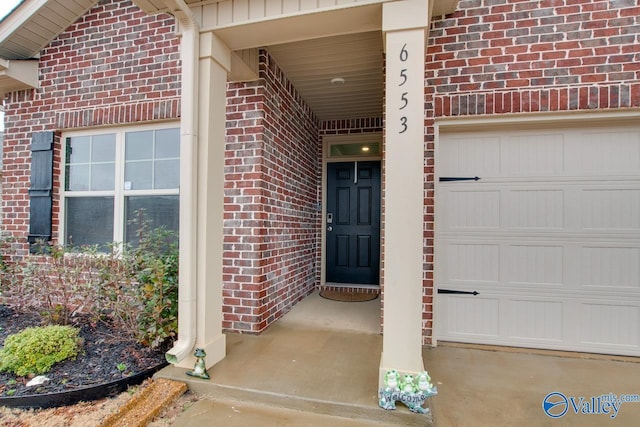 doorway to property with brick siding