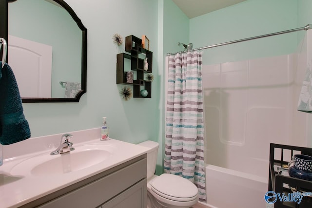 full bath featuring vanity, shower / tub combo, and toilet