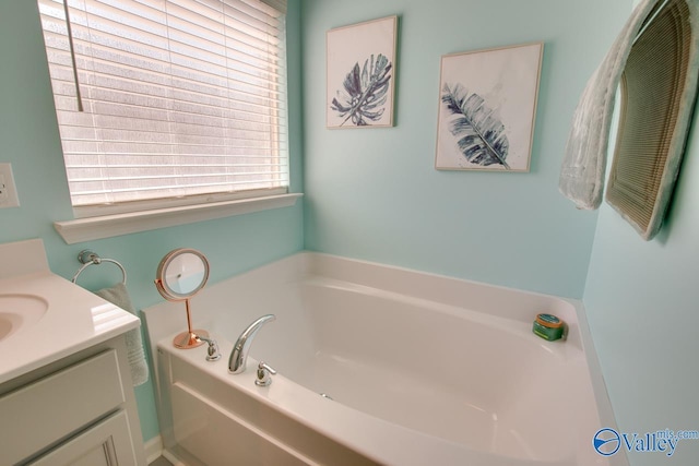 full bathroom with vanity and a garden tub