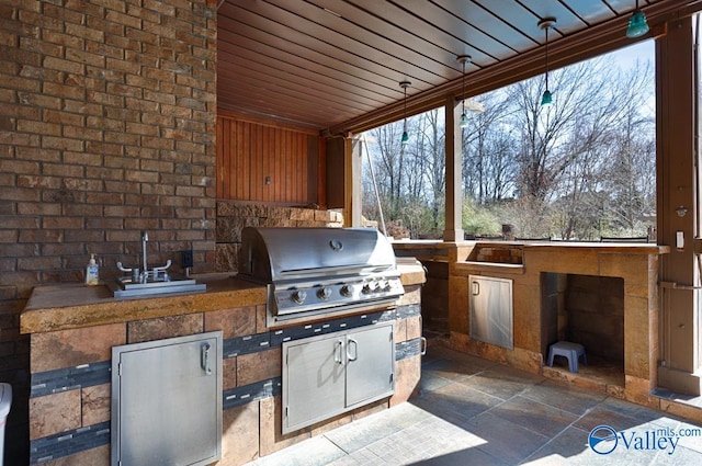 view of patio / terrace with a grill and exterior kitchen