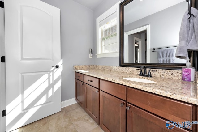 bathroom featuring vanity and baseboards