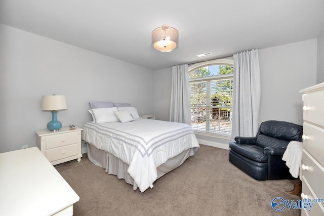 bedroom with light colored carpet