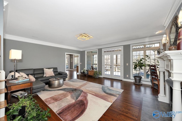 living room featuring crown molding, baseboards, wood finished floors, and french doors