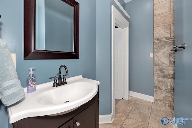 bathroom with vanity and baseboards