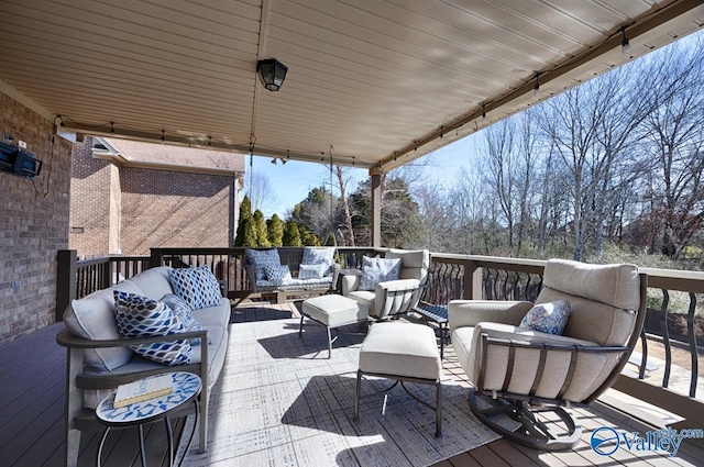 wooden terrace with outdoor lounge area