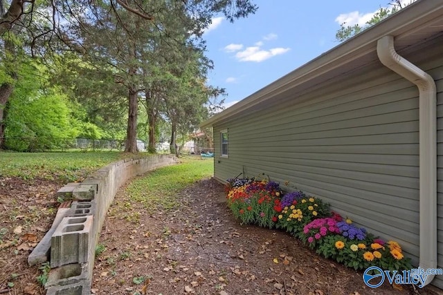 view of side of home with fence