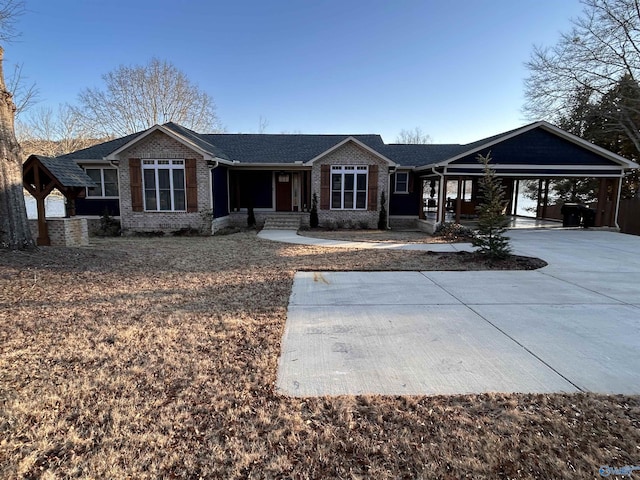 ranch-style home featuring a carport