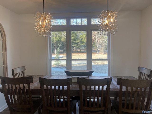 dining area featuring a notable chandelier