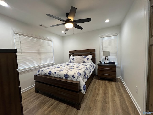 bedroom featuring dark wood-type flooring and ceiling fan