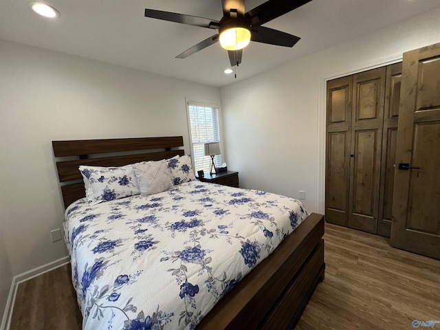 bedroom featuring dark wood-type flooring and ceiling fan