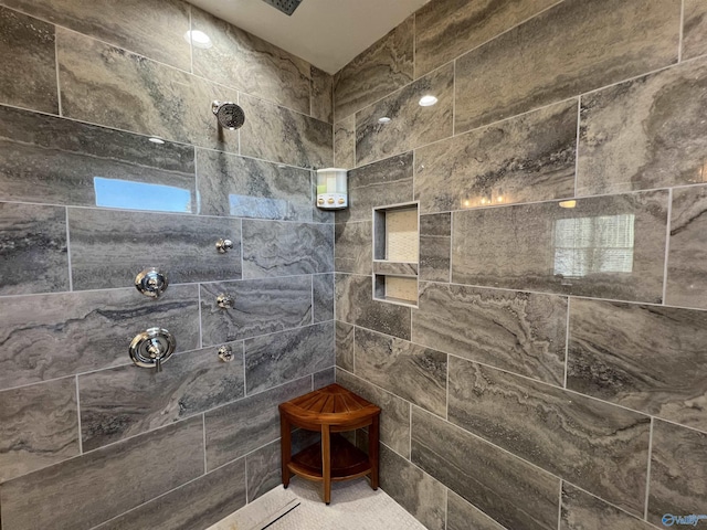 bathroom with tiled shower