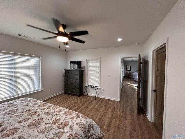 bedroom with dark wood-type flooring and ceiling fan