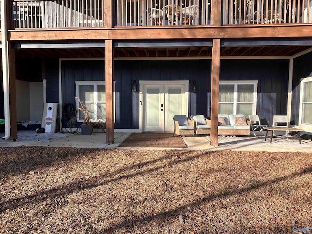 doorway to property featuring a patio area