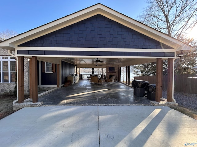 garage featuring a carport and ceiling fan