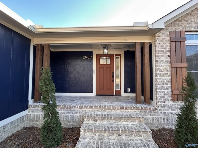 property entrance featuring a porch