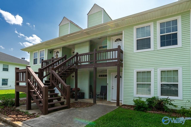 4114 Triana Blvd, Huntsville, AL 35802 - view of front facade with stairway and a wooden deck