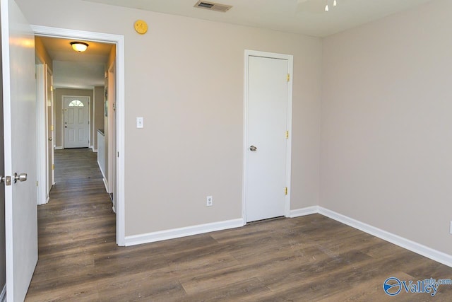 4114 Triana Blvd, Huntsville, AL 35802 - unfurnished bedroom with dark wood-type flooring