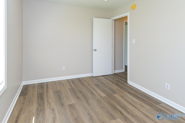 4114 Triana Blvd, Huntsville, AL 35802 - spare room with wood finished floors and a smoke detector