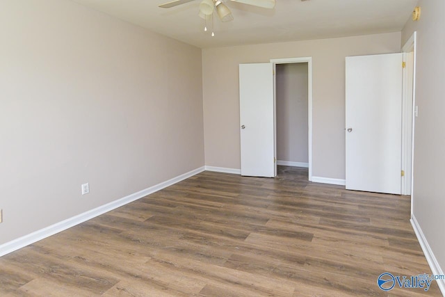 4114 Triana Blvd, Huntsville, AL 35802 - unfurnished bedroom with wood finished floors and ceiling fan