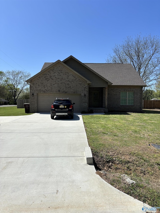 view of front of property featuring concrete driveway, a front lawn, brick siding, a garage, and fence