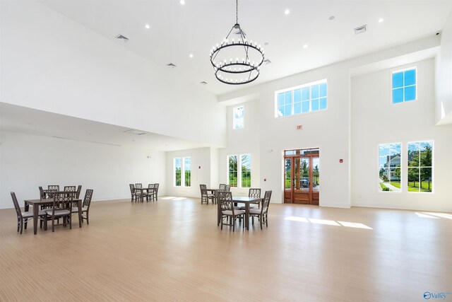 kitchen featuring plenty of natural light, sink, high end refrigerator, and light wood-type flooring