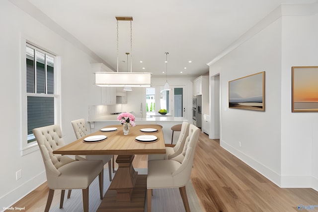 dining space with light wood-type flooring