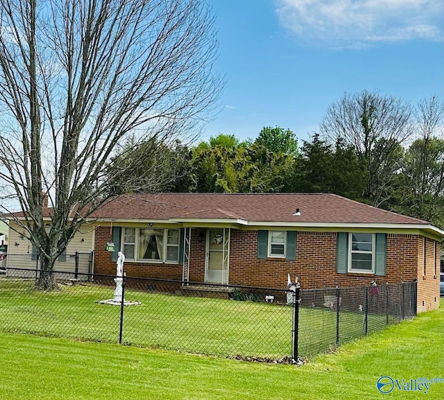 26740 Nick Davis Rd, Athens, AL 35613 - ranch-style house with brick siding, a fenced front yard, and a front yard