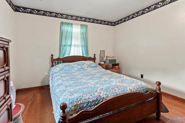26740 Nick Davis Rd, Athens, AL 35613 - bedroom featuring wood finished floors and baseboards