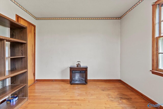 26740 Nick Davis Rd, Athens, AL 35613 - unfurnished living room featuring light wood-style flooring and baseboards