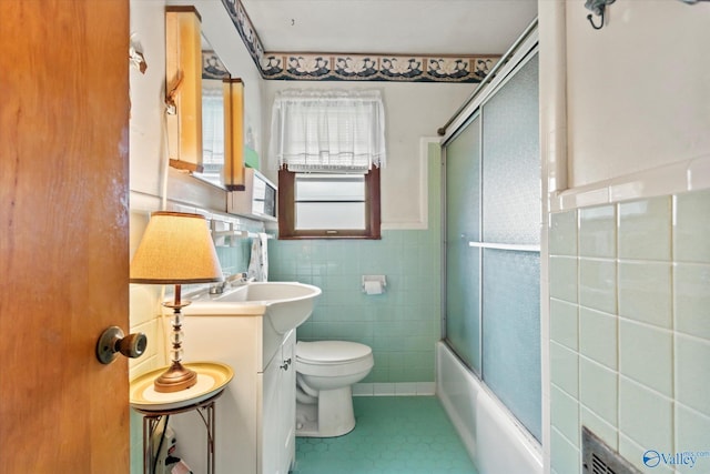 26740 Nick Davis Rd, Athens, AL 35613 - full bathroom with tile patterned flooring, tile walls, a wainscoted wall, toilet, and vanity