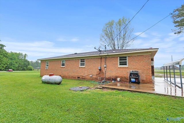 26740 Nick Davis Rd, Athens, AL 35613 - rear view of property featuring a yard, a patio, crawl space, and brick siding