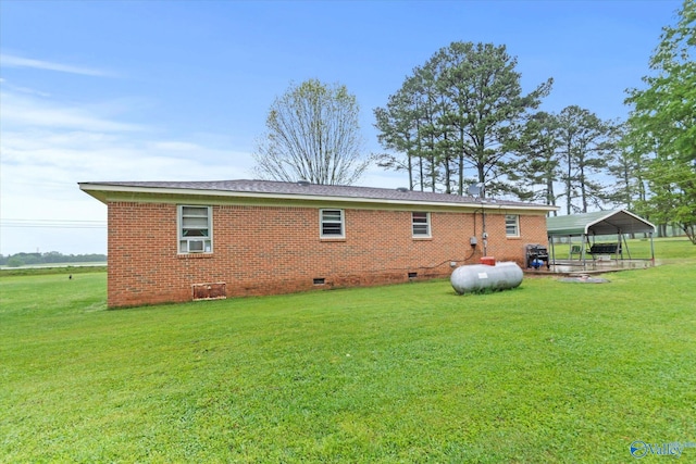 26740 Nick Davis Rd, Athens, AL 35613 - back of house featuring a detached carport, a yard, crawl space, and brick siding