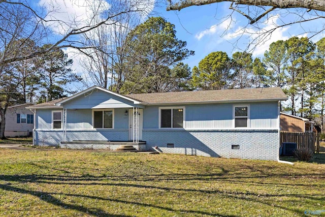 view of front of house with brick siding and a front lawn