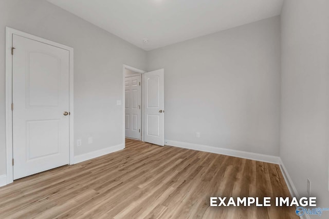297 Keller Dr, Hazel Green, AL 35750 - empty room featuring wood finished floors and baseboards