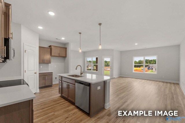 297 Keller Dr, Hazel Green, AL 35750 - kitchen featuring light wood-style floors, stainless steel appliances, a sink, and light countertops