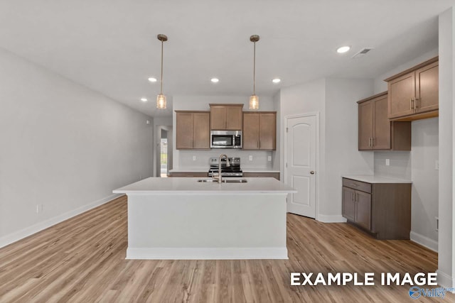 297 Keller Dr, Hazel Green, AL 35750 - kitchen featuring a sink, visible vents, light countertops, appliances with stainless steel finishes, and light wood-type flooring