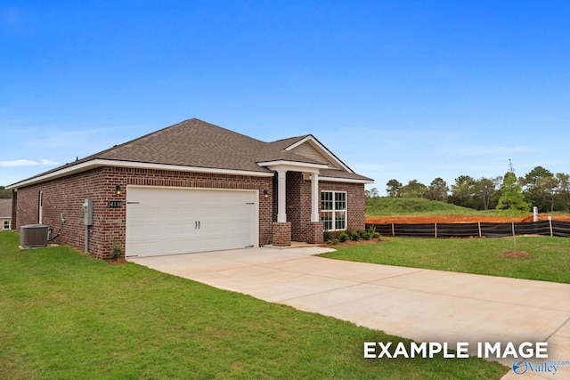 297 Keller Dr, Hazel Green, AL 35750 - view of front of home with driveway, an attached garage, fence, a front yard, and brick siding