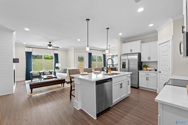 297 Keller Dr, Hazel Green, AL 35750 - kitchen with tasteful backsplash, open floor plan, stainless steel appliances, crown molding, and a sink