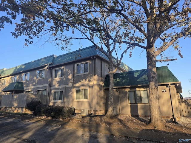 view of side of property with cooling unit