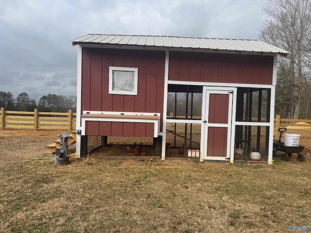 view of outdoor structure featuring a lawn