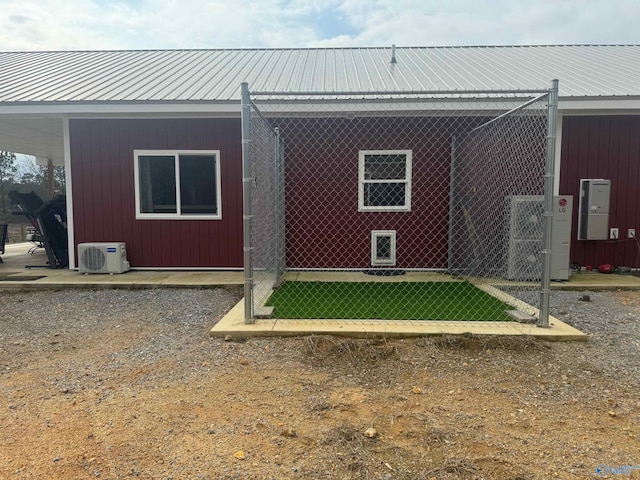 rear view of property featuring ac unit