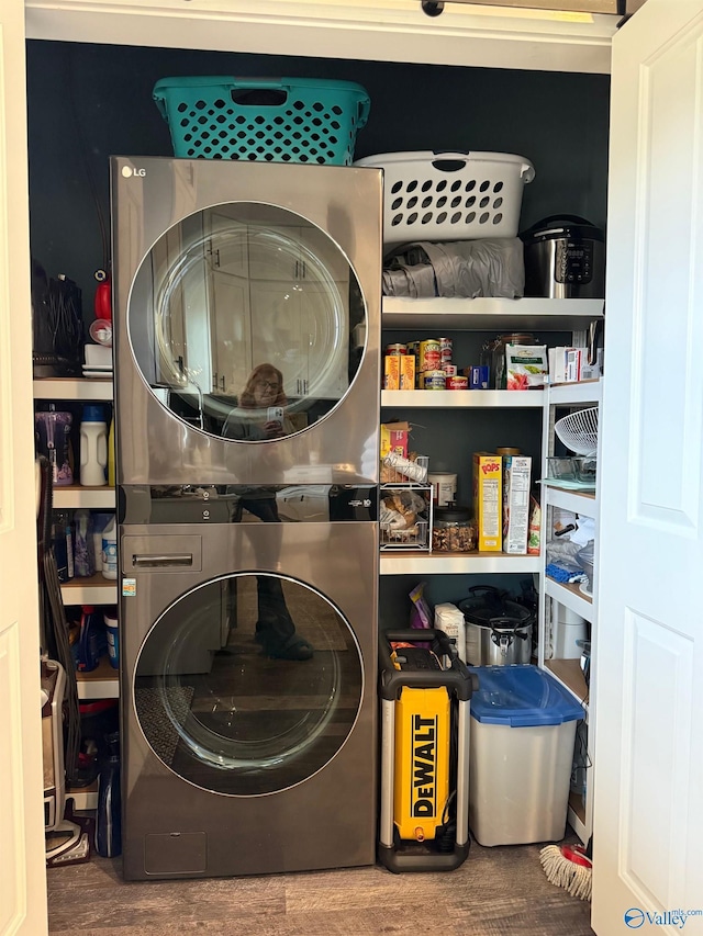 laundry area with stacked washer / drying machine